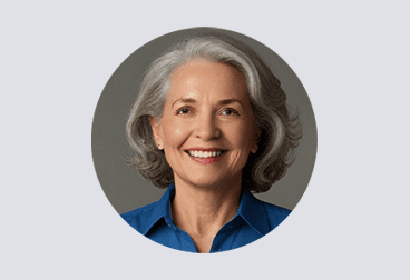 face of female freelancer with gray hair wearing a blue shirt