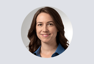 Head and shoulders photo of female freelancer smiling and wearing a blue shirt