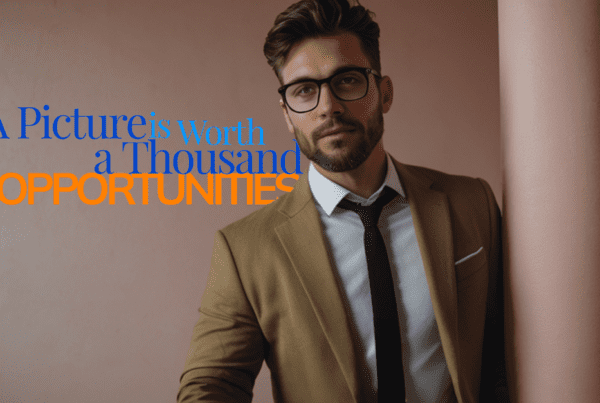 a male freelancer with a beard and glasses stands against a column in front of a wall. He is wearing a brown jacket with a white shirt and black tie. The title of the blog appears on the image